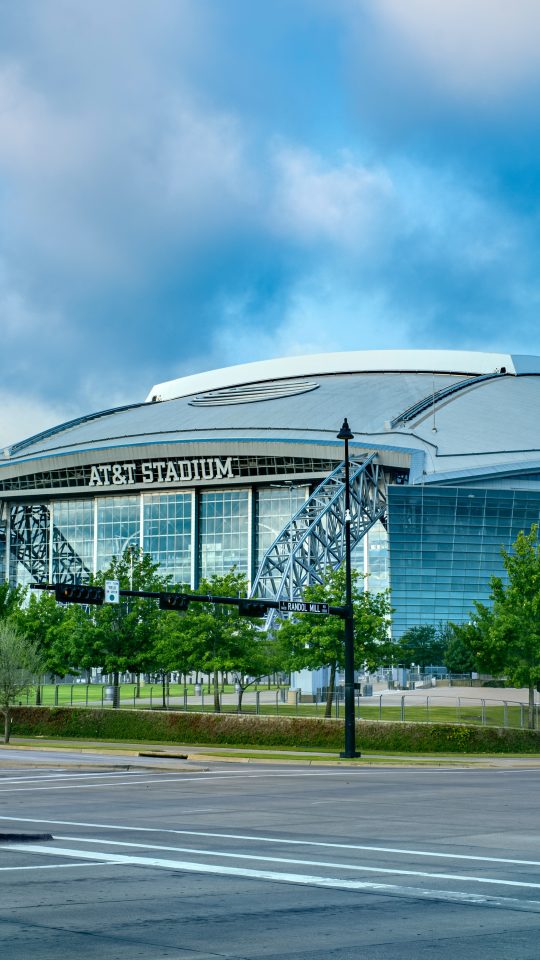 glass building near green trees during daytime